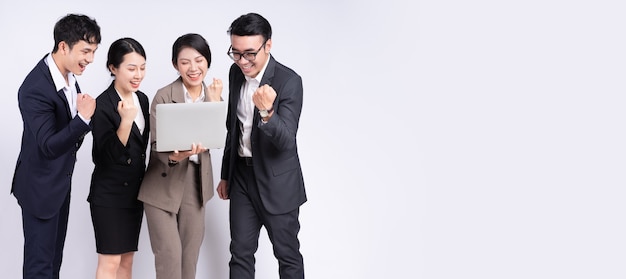 Group of asian business people posing on a white background