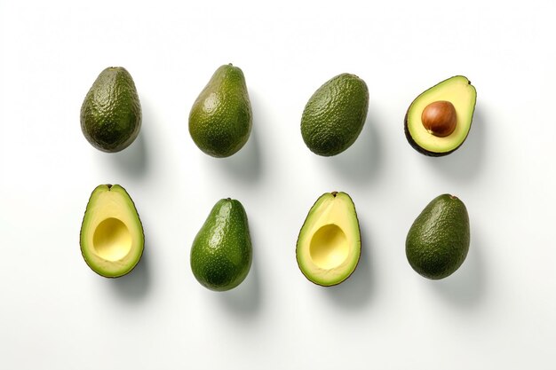 Photo a group of avocados on a white surface