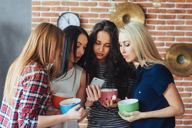 Group beautiful young people enjoying in conversation and drinking coffee, best friends girls together having fun, posing emotional lifestyle  