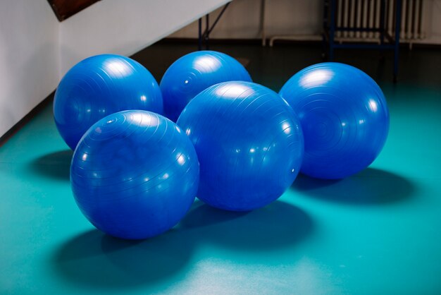 Group of blue pilates balls in the gym