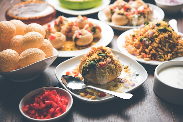 Group of Bombay chat food includes golgappa or panipuri, bhel-puri, sev-poori, dahipuri, Ragda pattice, raj kachori etc. selective focus