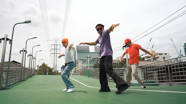 Photo group of break dancer dancing together or moving to hip hop music sprightly