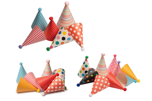 Photo a group of bright and colorful birthday caps isolated on a white background