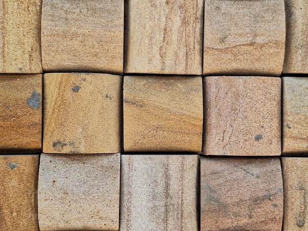 Photo a group of brown tiles with a black mark on the bottom.