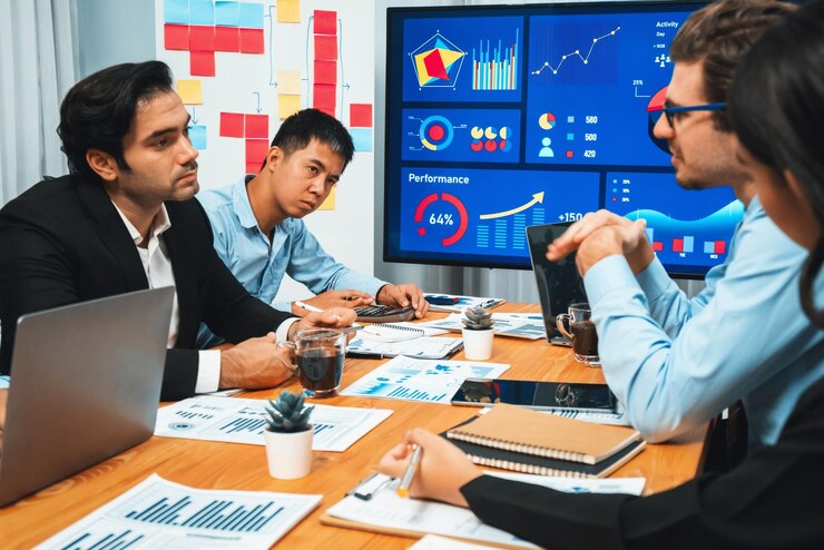 फोटो group of business analyst team analyzing financial data report habiliment