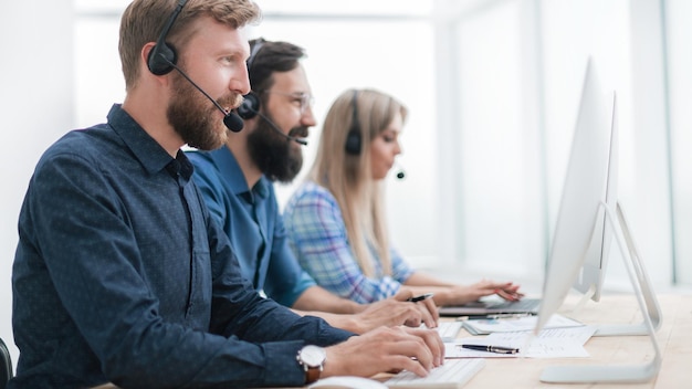 Group of business center consultants working in the call center. photo with copy space