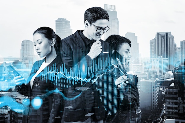 Group of business colleagues in suits as a part of
multinational corporate team working on forecasting trading
corporate strategy at fund forex chart bangkok on background double
exposure