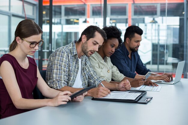 Group of business executives working during meeting