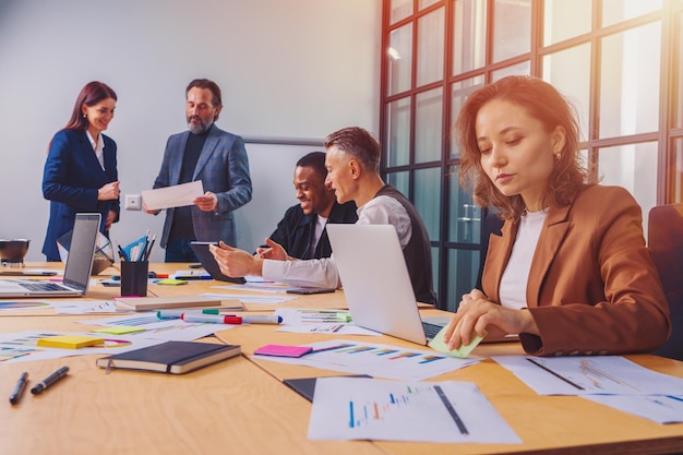 Group of business people have a meeting about company stats