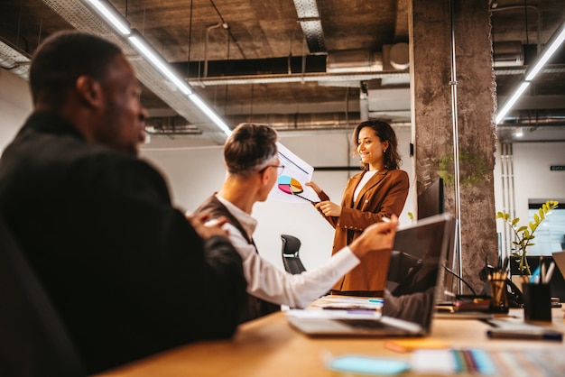 Group of business people have a meeting about company stats