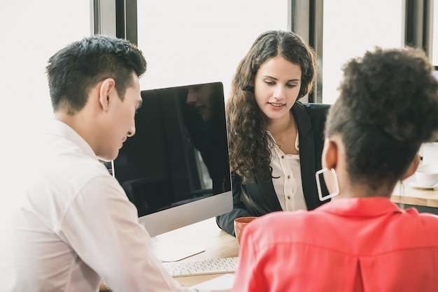 Group of business people in an office meeting