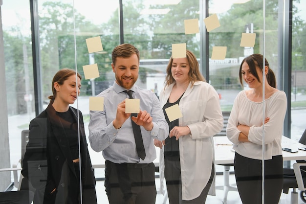 A group of business people partners during a set team meeting in the modern office Teamwork concept