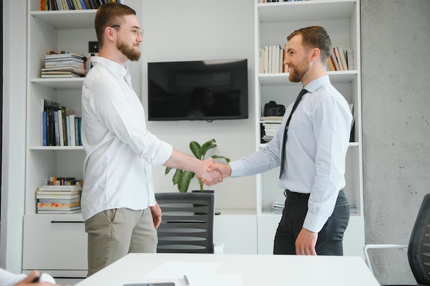 A group of business people partners during a set team meeting in the modern office Teamwork concept