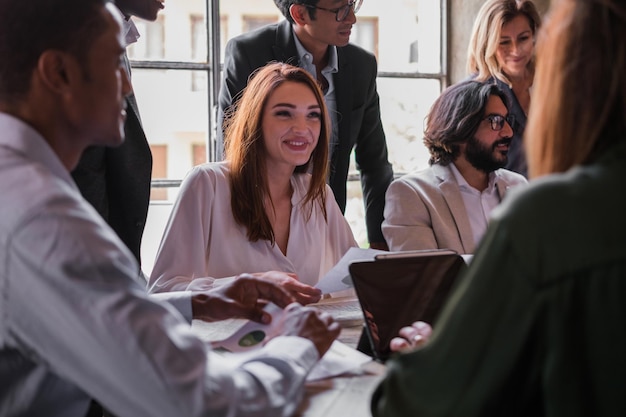 Group of business people sharing coworking space focus on young
girl in white shirt