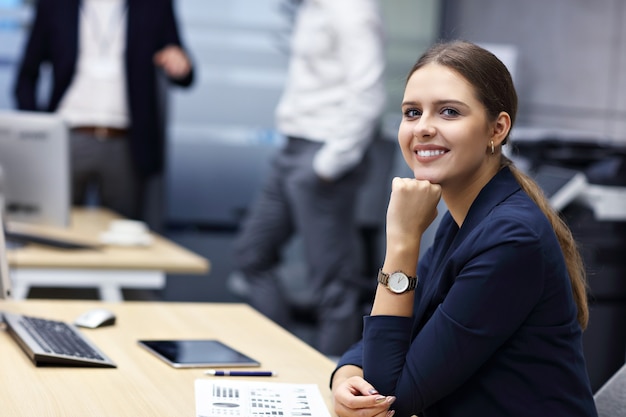 Group of business people sharing ideas in modern office