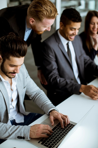 Group of business people sharing their ideas in the office