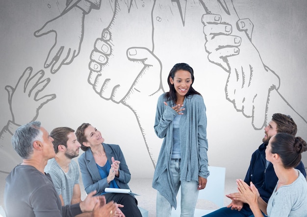Group of business people sitting in circle meeting in front of hands reaching for each other drawing