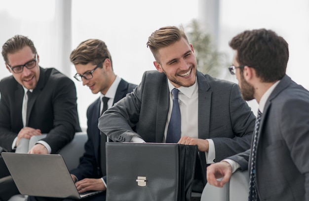 Group of business people sitting in the lobby of the business centerphoto with copy space