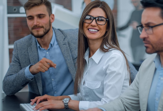 Group of business people sitting at the office table