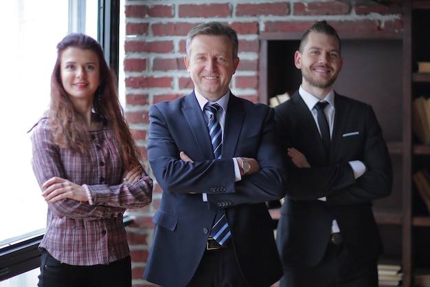 Group of business people standing in modern office