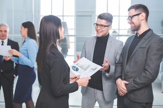 Group of business people standing in the office lobby. business concept