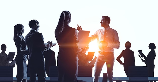 Group of business people with lit background. Mixed media