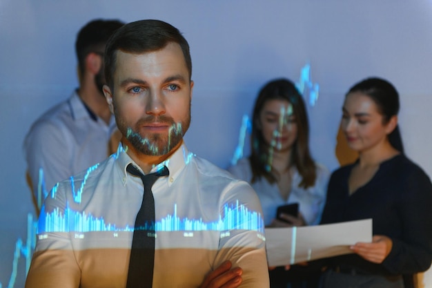 Group of business people working at modern officeTechnical price graph red and blue candlestick chart and stock trading computer screen background Double exposure Traders analyzing data