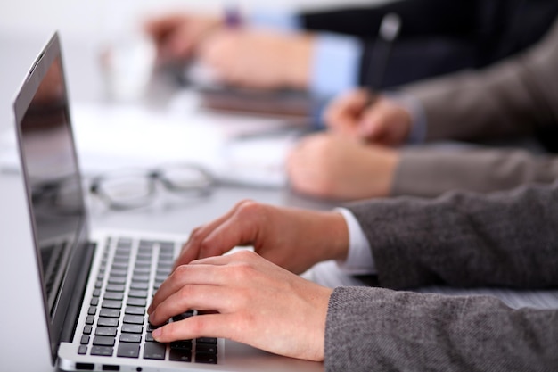 Group of business people working together in office.