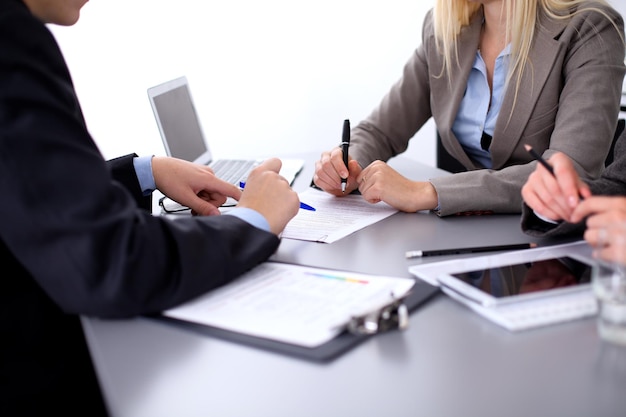 Group of business people working together in office.