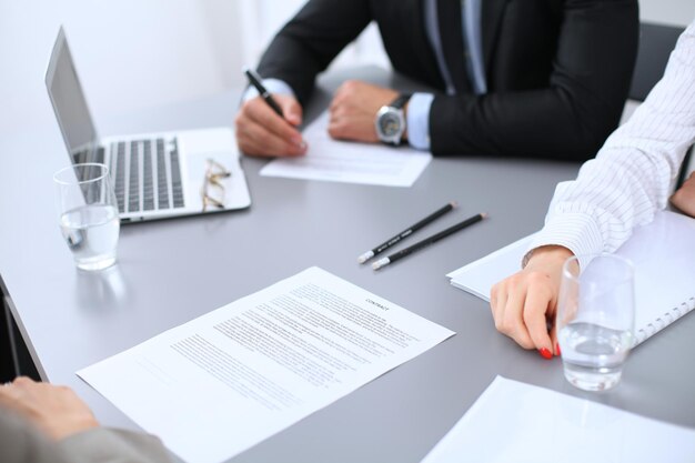 Group of business people working together in office.