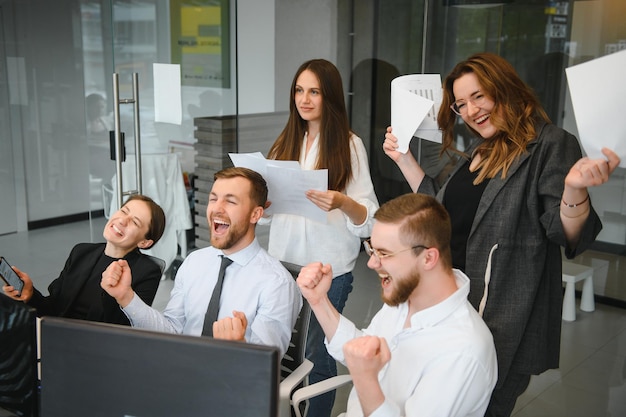 Group of businessmen and businesswomen stock brokers working at office.