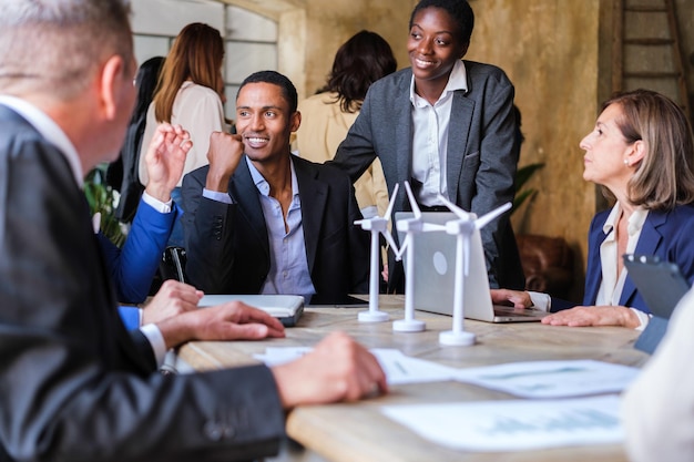 Group of businessmen meeting talking about renewable energy