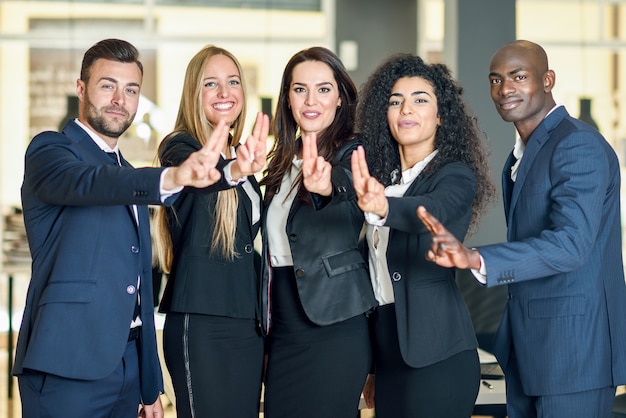 Group of businesspeople with thumbs up 