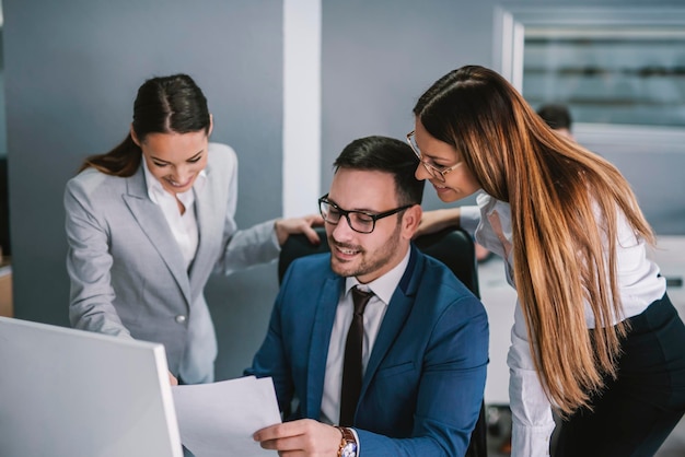 Group of businesspeople working on solution at modern office