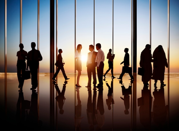 Photo group of busy business people in the building interior.