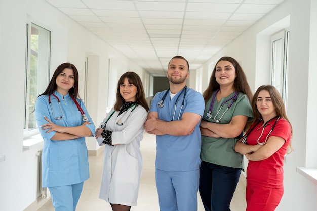 Group of caucasian students or young doctors in corridor of medical clinic