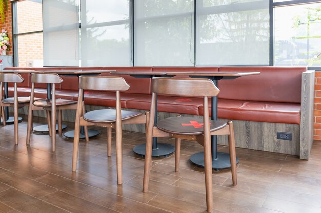 Photo group of chairs in coffee shop, empty on people, covid-19 concept