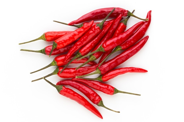 Group of chili peppers isolated on white surface.