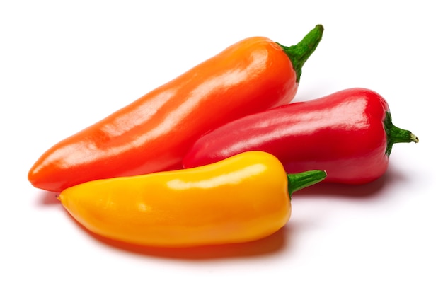 Group of chili or sweet peppers isolated on white surface