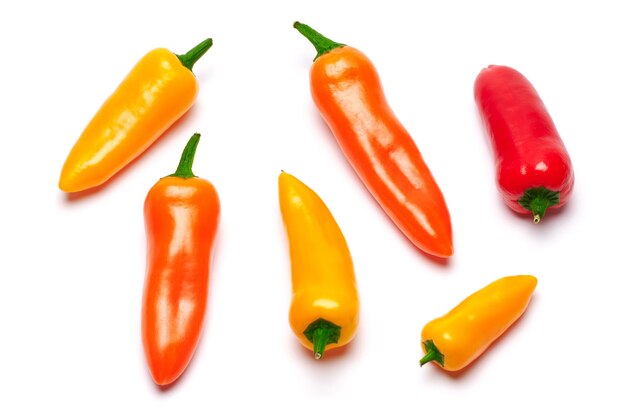 Group of chili or sweet peppers isolated on white surface