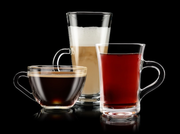 Group of coffee and tea cups over black background