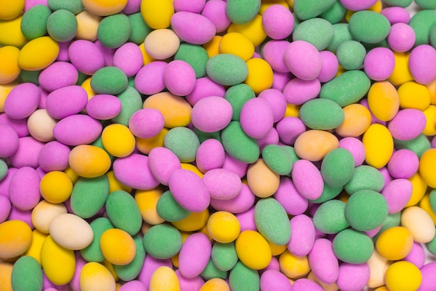 Group of colorful peanuts in glaze. Top view.