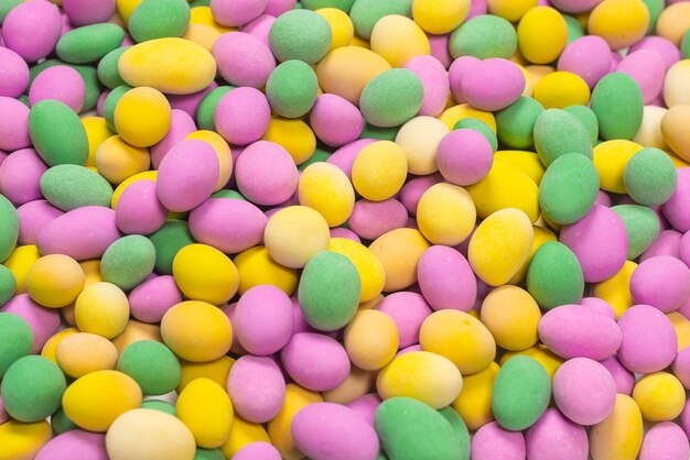 Group of colorful peanuts in glaze. Top view.