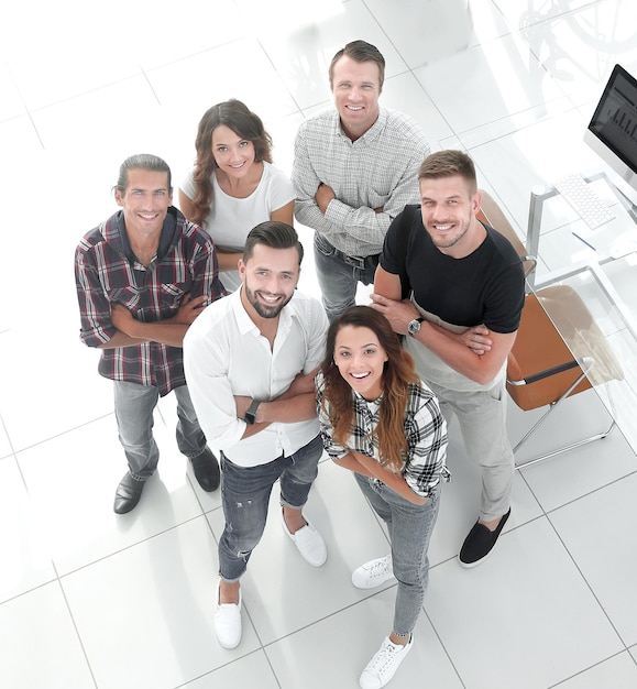 Group of creative professionals standing in office