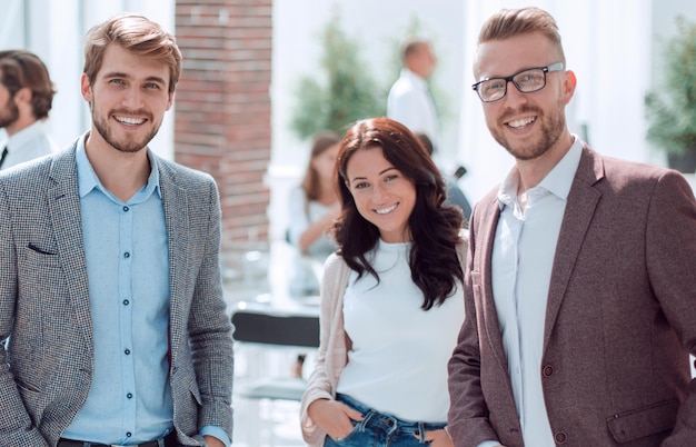 Group of creative young business people standing in the office