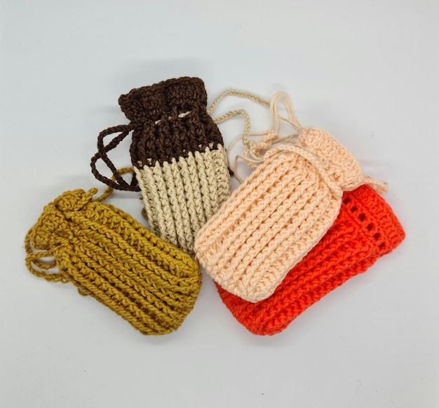 A group of crochet bags with different colors