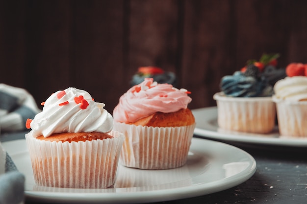 Group of cupcakes on dark selective focus