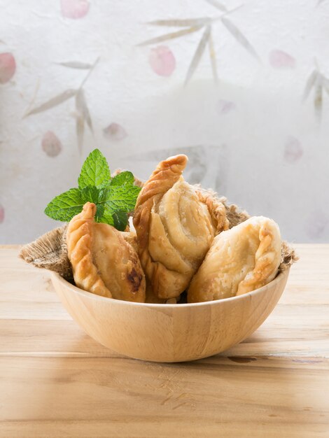 Group of curry puff with coffee.