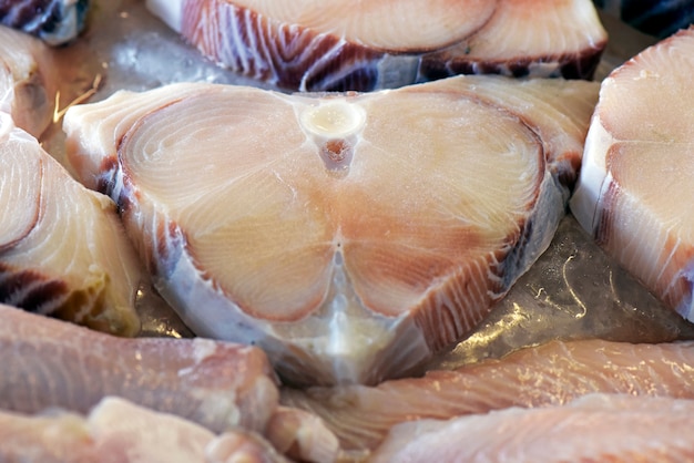 Group of cut fish deposited in ice