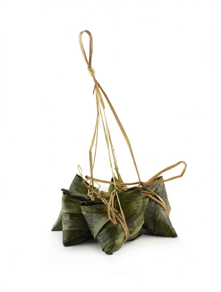 Group of delicious zongzi on white